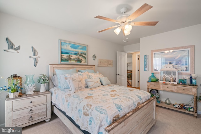 bedroom with light colored carpet and ceiling fan