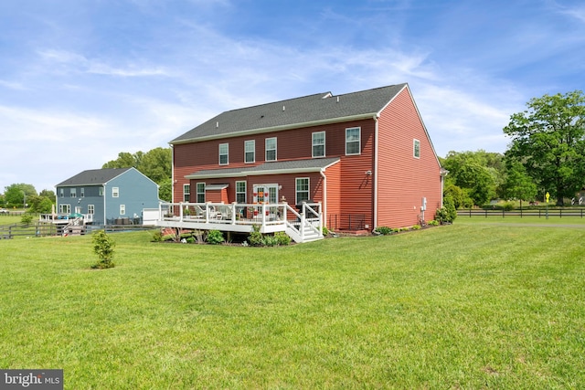 back of property featuring a deck