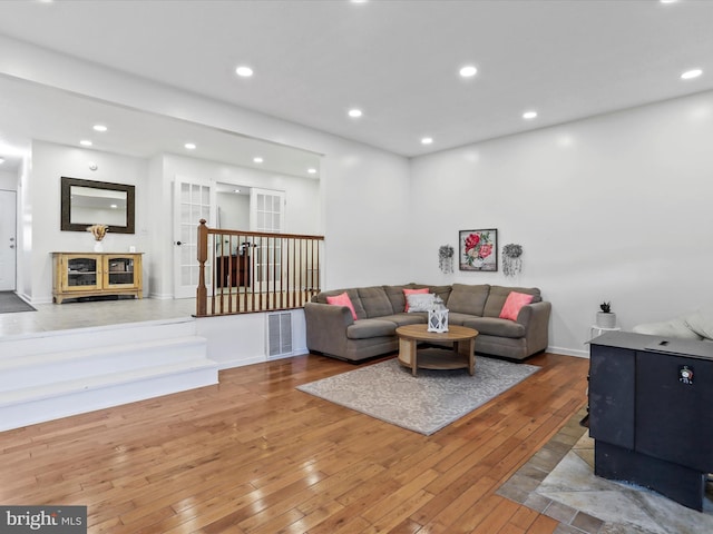 living room featuring hardwood / wood-style floors and recessed lighting