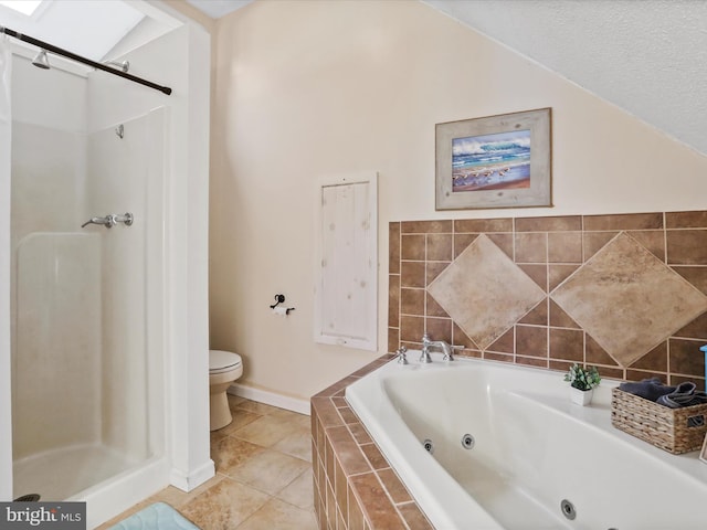 bathroom with a shower stall, toilet, a jetted tub, tile patterned floors, and baseboards