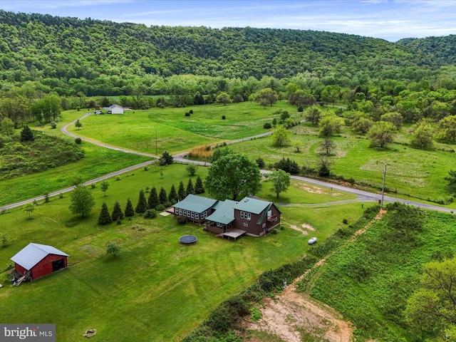 aerial view of sparsely populated area with a heavily wooded area