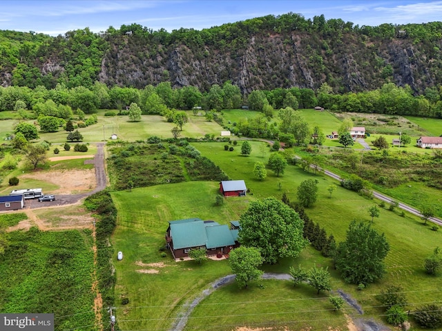 view of rural area featuring a heavily wooded area