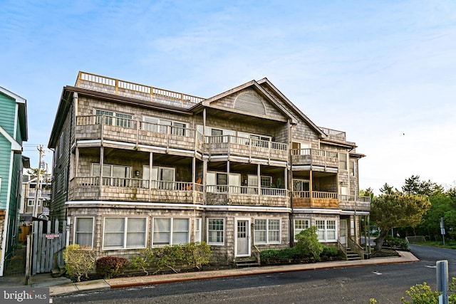view of front of home with a balcony