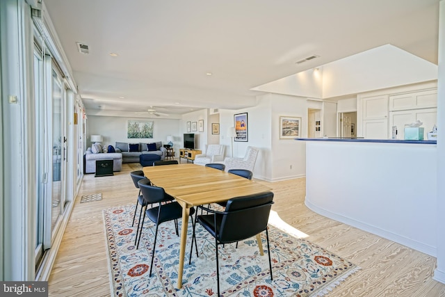dining space with light wood-type flooring, ceiling fan, baseboards, and recessed lighting