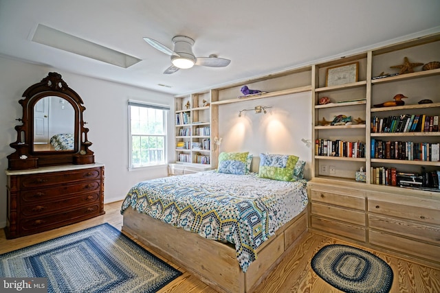bedroom featuring wood finished floors and a ceiling fan