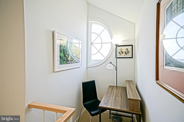 home office featuring lofted ceiling