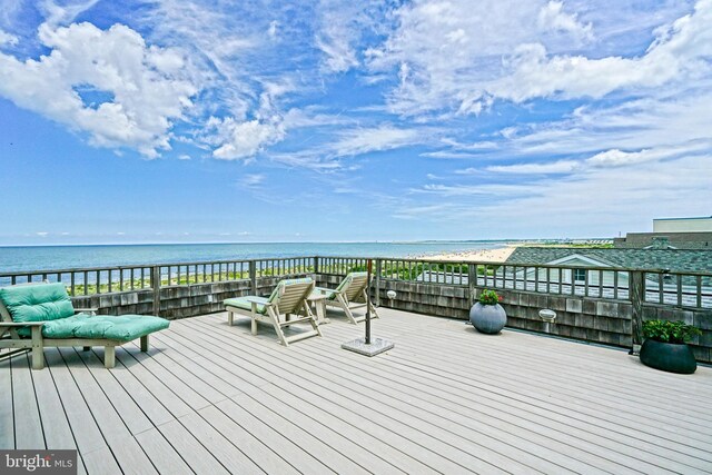 wooden terrace with a water view