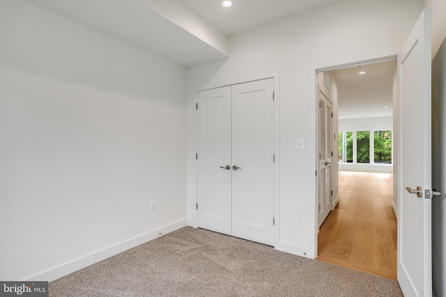 4902 D St SE, Washington, DC 20019 - unfurnished bedroom featuring recessed lighting, baseboards, light colored carpet, and a closet