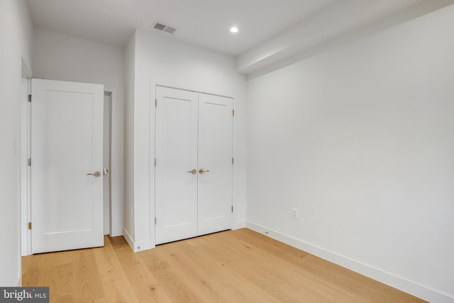 4902 D St SE, Washington, DC 20019 - unfurnished bedroom featuring light wood-style floors, baseboards, recessed lighting, and a closet