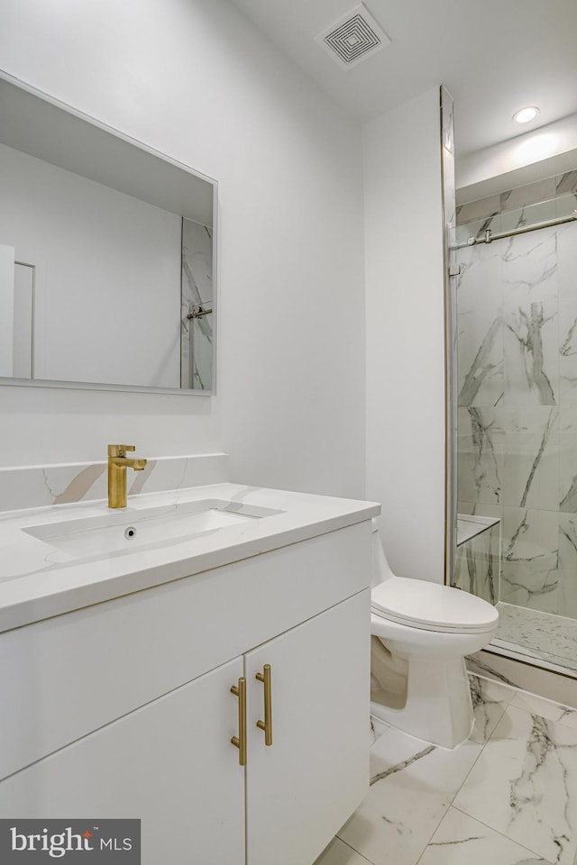 4902 D St SE, Washington, DC 20019 - bathroom featuring vanity, toilet, a marble finish shower, recessed lighting, and marble look tile flooring