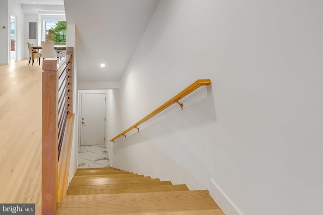 4902 D St SE, Washington, DC 20019 - stairway with recessed lighting, baseboards, electric panel, and marble look tile flooring