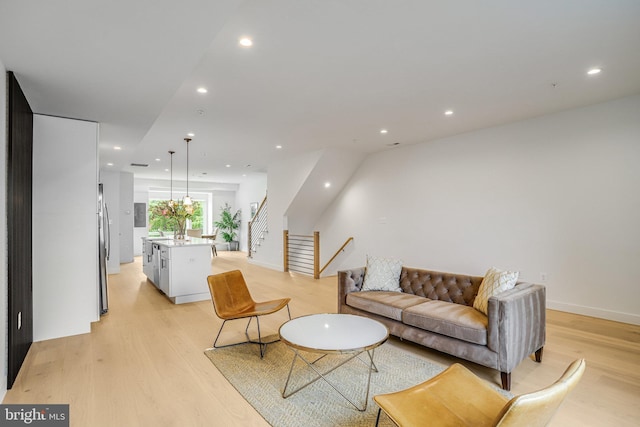 4902 D St SE, Washington, DC 20019 - living room featuring light wood-type flooring, recessed lighting, and stairs