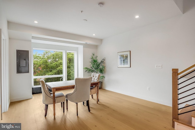 4902 D St SE, Washington, DC 20019 - dining space featuring electric panel, stairway, light wood-style flooring, recessed lighting, and baseboards