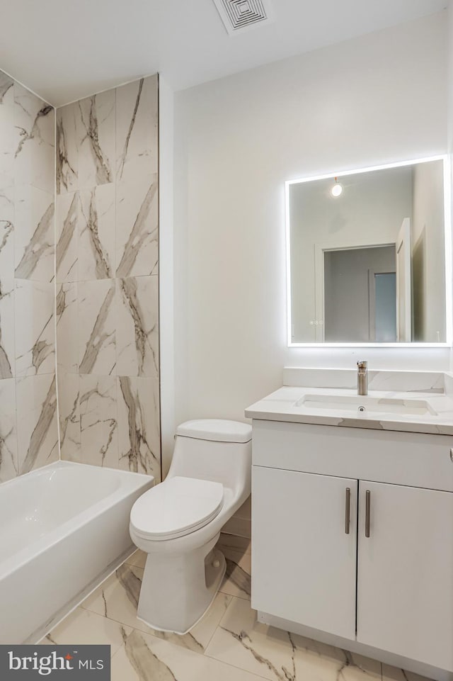 4902 D St SE, Washington, DC 20019 - bathroom with vanity, marble look tile flooring, toilet, and washtub / shower combination