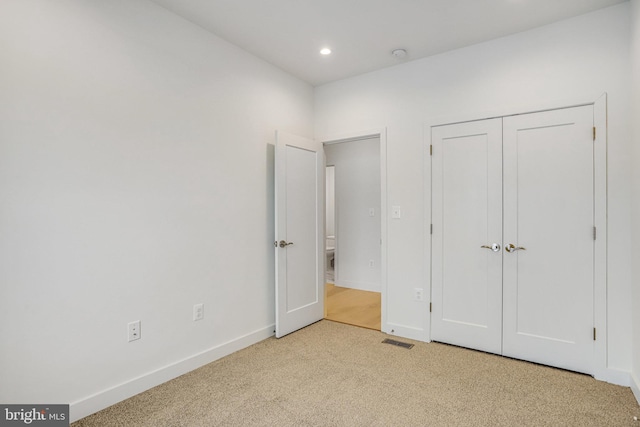4902 D St SE, Washington, DC 20019 - unfurnished bedroom featuring carpet floors, baseboards, recessed lighting, and a closet