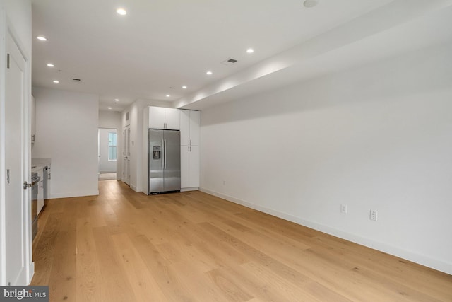 4902 D St SE, Washington, DC 20019 - empty room with light wood-style flooring, recessed lighting, and baseboards