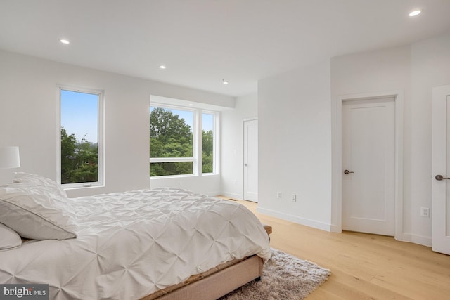 4902 D St SE, Washington, DC 20019 - bedroom with light wood finished floors, recessed lighting, and baseboards