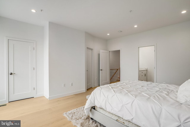 4902 D St SE, Washington, DC 20019 - bedroom featuring light wood-type flooring, recessed lighting, and baseboards