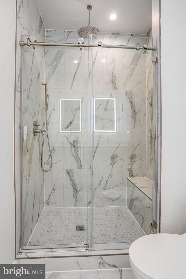 4902 D St SE, Washington, DC 20019 - full bath featuring toilet, a marble finish shower, marble look tiles, and recessed lighting