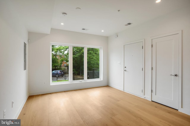 4902 D St SE, Washington, DC 20019 - empty room with light wood-style flooring, recessed lighting, baseboards, and a smoke detector