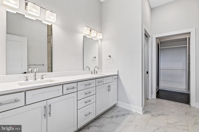 44691 Wellfleet Dr Unit 508, Ashburn, VA 20147 - full bath with baseboards, marble finish flooring, double vanity, and a spacious closet