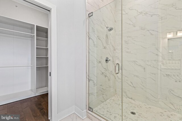 44691 Wellfleet Dr Unit 508, Ashburn, VA 20147 - bathroom with a stall shower, baseboards, and a spacious closet