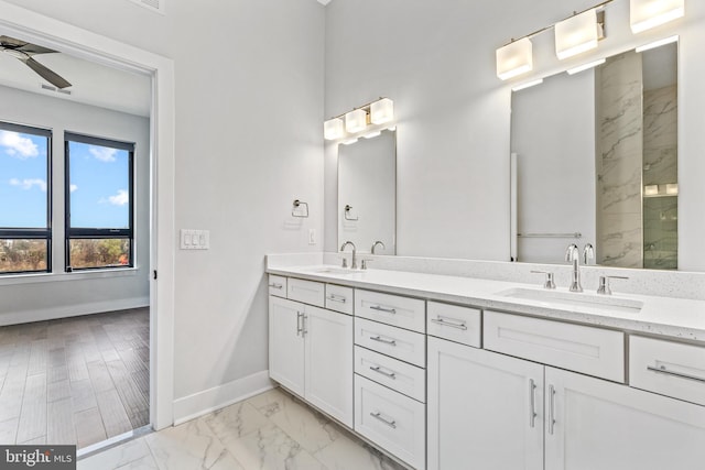 44691 Wellfleet Dr Unit 508, Ashburn, VA 20147 - full bath featuring baseboards, marble finish flooring, ceiling fan, double vanity, and a shower