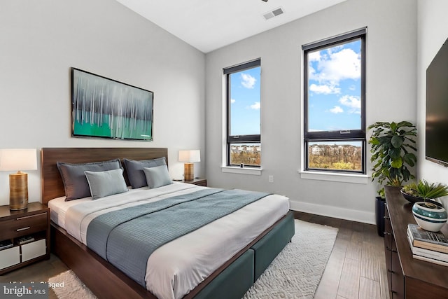44691 Wellfleet Dr Unit 508, Ashburn, VA 20147 - bedroom with multiple windows, baseboards, and hardwood / wood-style floors
