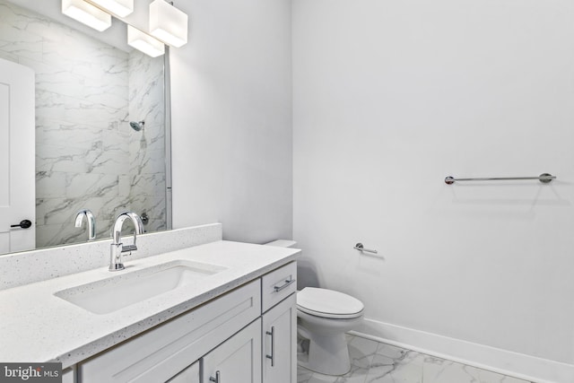44691 Wellfleet Dr Unit 508, Ashburn, VA 20147 - bathroom with marble look tiles, vanity, toilet, a shower, and baseboards