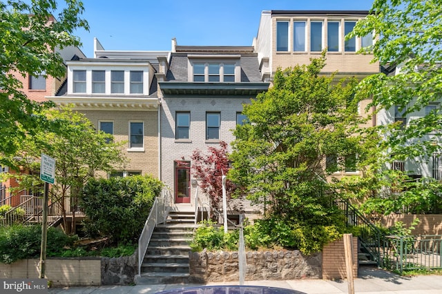 2448 Ontario Rd NW Unit 3, Washington, DC 20009 - view of property featuring mansard roof and brick siding