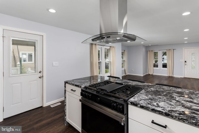 kitchen featuring range with gas cooktop, dark stone counters, island range hood, dark wood-style floors, and recessed lighting