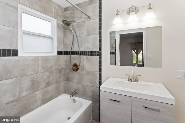 bathroom featuring shower / bath combination, healthy amount of natural light, and vanity