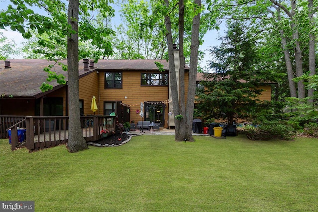 915 Burberry Ct, Sicklerville, NJ 08081 - back of house with a chimney, a lawn, a wooden deck, and roof with shingles