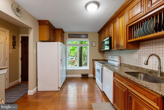 915 Burberry Ct, Sicklerville, NJ 08081 - kitchen with white appliances, a sink, dark wood-style flooring, backsplash, and brown cabinets