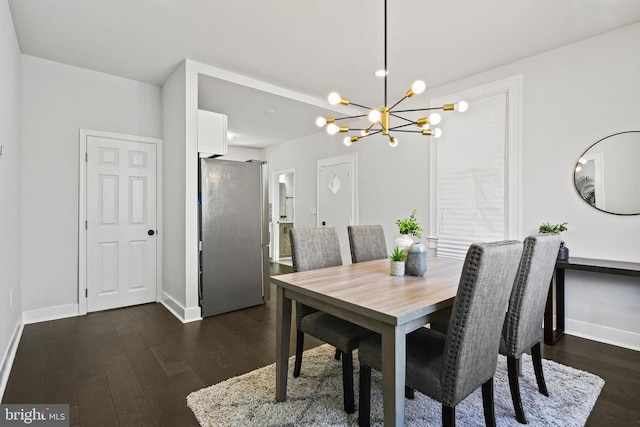 dining space featuring a chandelier, dark wood-style floors, and baseboards