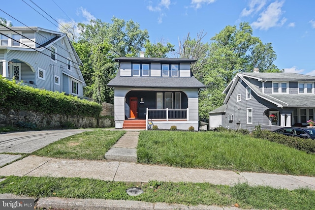 view of front of property featuring covered porch