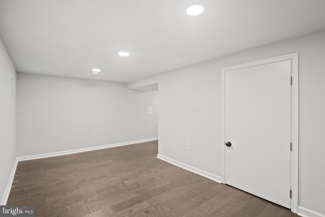 finished basement with wood finished floors, baseboards, and recessed lighting