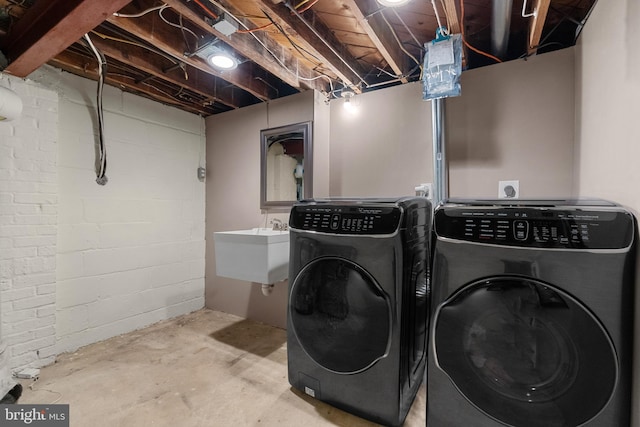 304 Moncure Dr, Alexandria, VA 22314 - laundry area with laundry area, washer and clothes dryer, and a sink