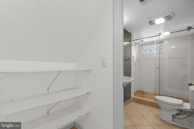 304 Moncure Dr, Alexandria, VA 22314 - bathroom with toilet, visible vents, tile patterned flooring, and a stall shower