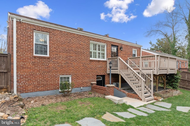 304 Moncure Dr, Alexandria, VA 22314 - back of property with a yard, brick siding, fence, and a deck