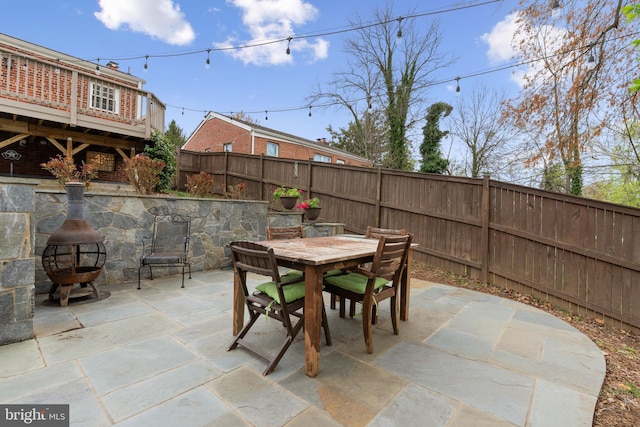 304 Moncure Dr, Alexandria, VA 22314 - view of patio / terrace with an outdoor fire pit, fence, and outdoor dining area