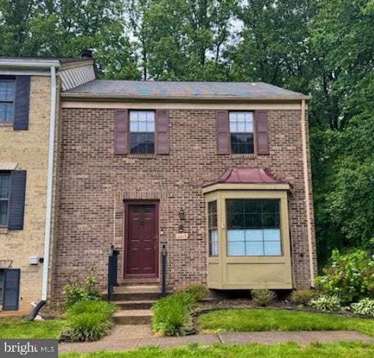 6015 Clerkenwell Ct, Burke, VA 22015 - view of front of house featuring brick siding and view of wooded area