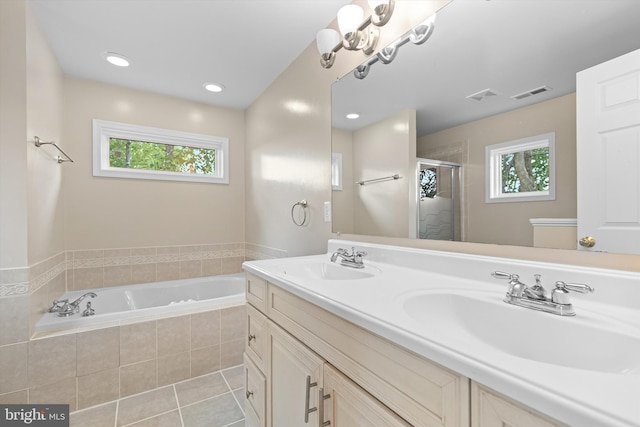 bathroom with a stall shower, a garden tub, tile patterned flooring, double vanity, and recessed lighting