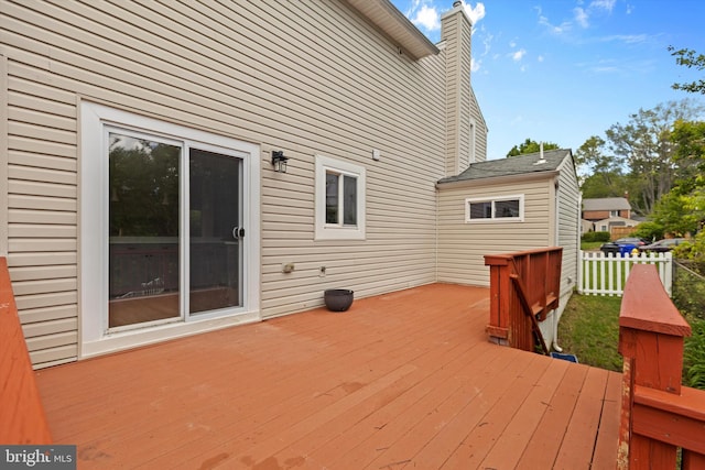 wooden deck featuring fence