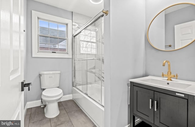 22 Duncan Ave, Westville, NJ 08093 - full bathroom with toilet, baseboards, vanity, bath / shower combo with glass door, and tile patterned floors