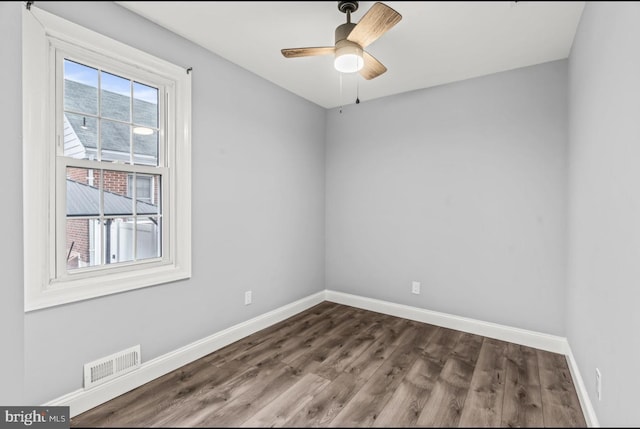 22 Duncan Ave, Westville, NJ 08093 - spare room with baseboards, dark wood-style floors, and a ceiling fan