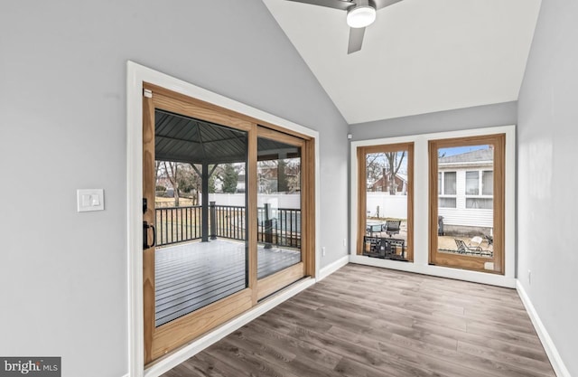 22 Duncan Ave, Westville, NJ 08093 - doorway with healthy amount of natural light, dark wood-style flooring, vaulted ceiling, baseboards, and a ceiling fan