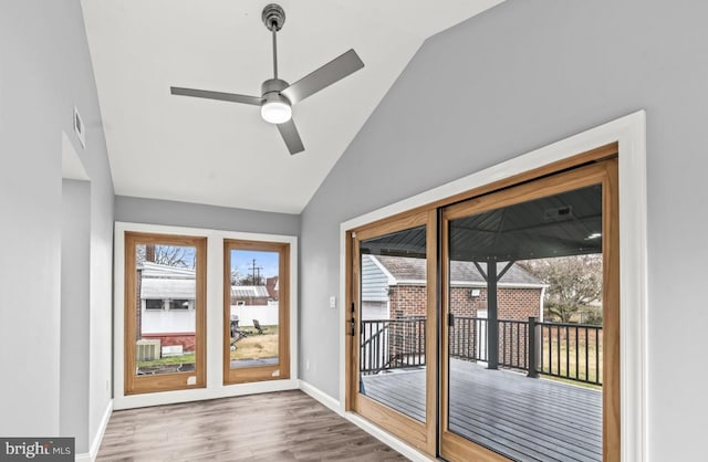 22 Duncan Ave, Westville, NJ 08093 - doorway with vaulted ceiling, wood finished floors, ceiling fan, and baseboards