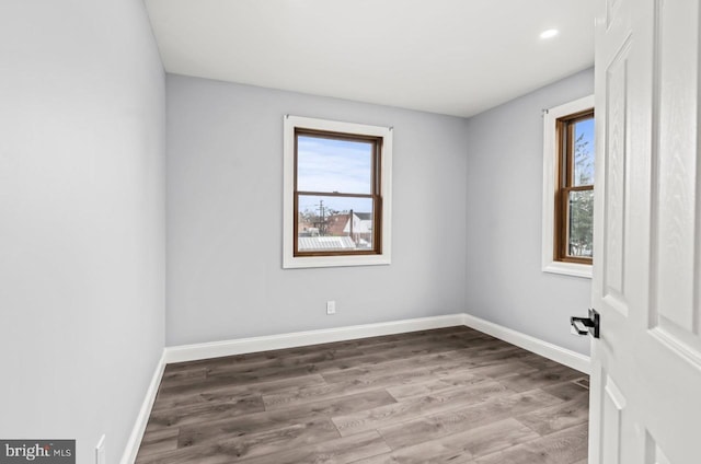 22 Duncan Ave, Westville, NJ 08093 - spare room with healthy amount of natural light, wood finished floors, baseboards, and recessed lighting