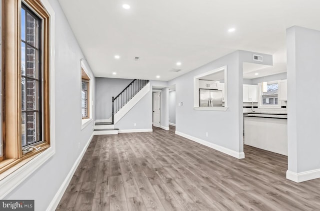 22 Duncan Ave, Westville, NJ 08093 - unfurnished living room featuring light wood finished floors, stairway, recessed lighting, and baseboards